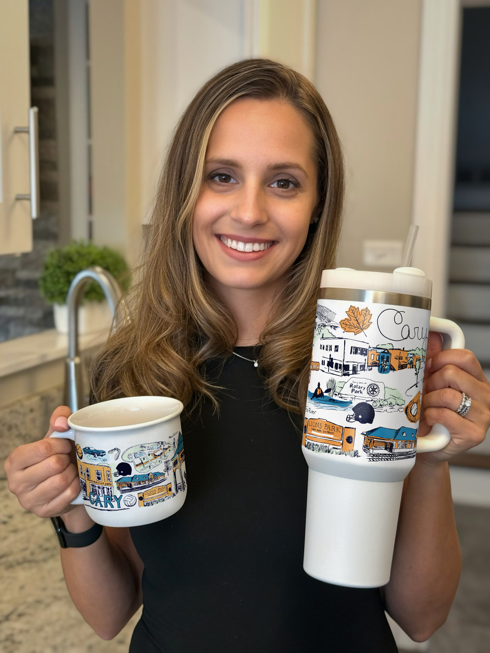 Ashley Ann holding The Cary Mug and matching tumbler
