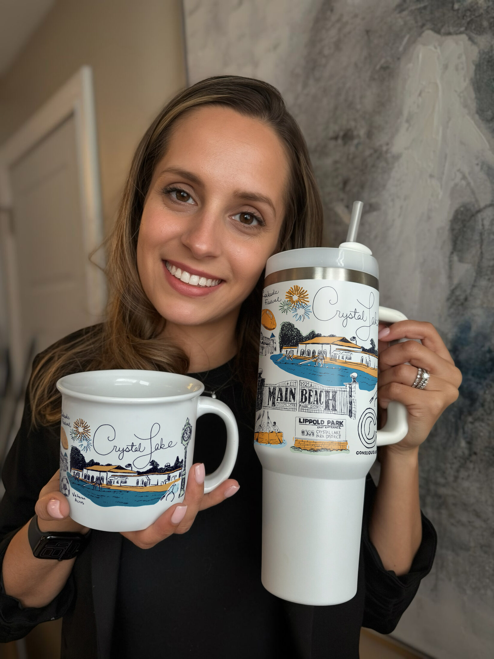 Ashley Ann holding The Crystal Lake Mug and matching tumbler