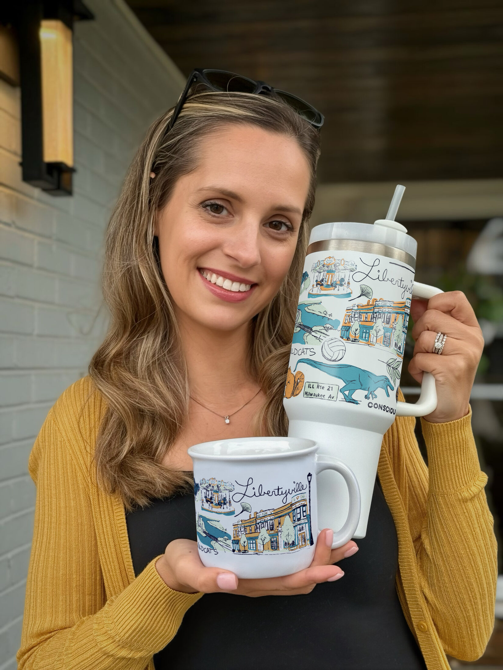 Ashley Ann holding The Libertyville Mug and matching tumbler