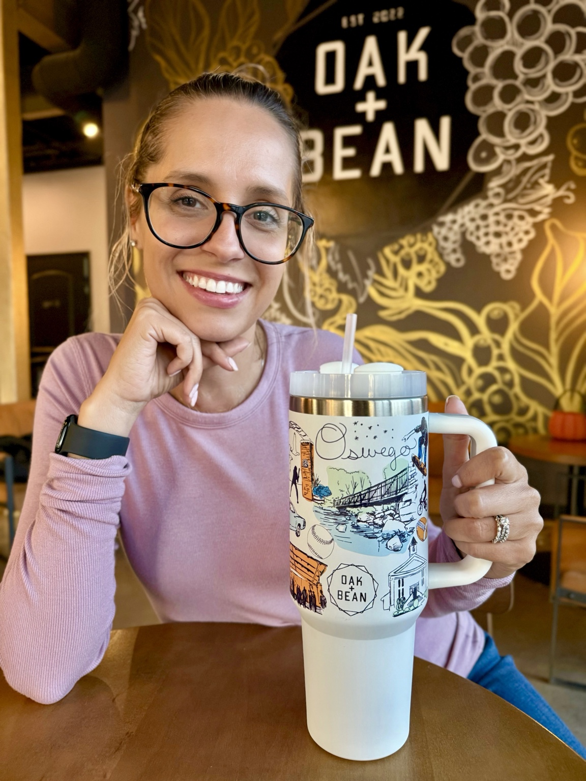 Ashley holding The Oswego Mug tumbler inside Oak and Bean