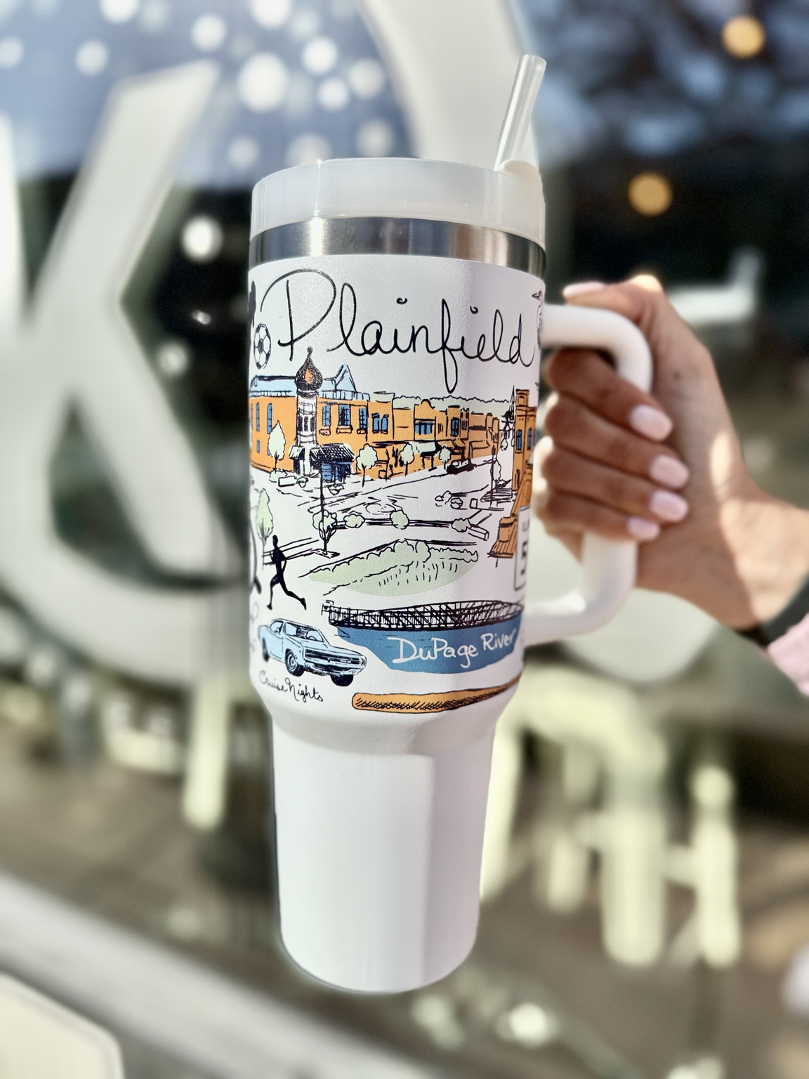 Close-up of the hand-drawn Plainfield artwork on the travel tumbler