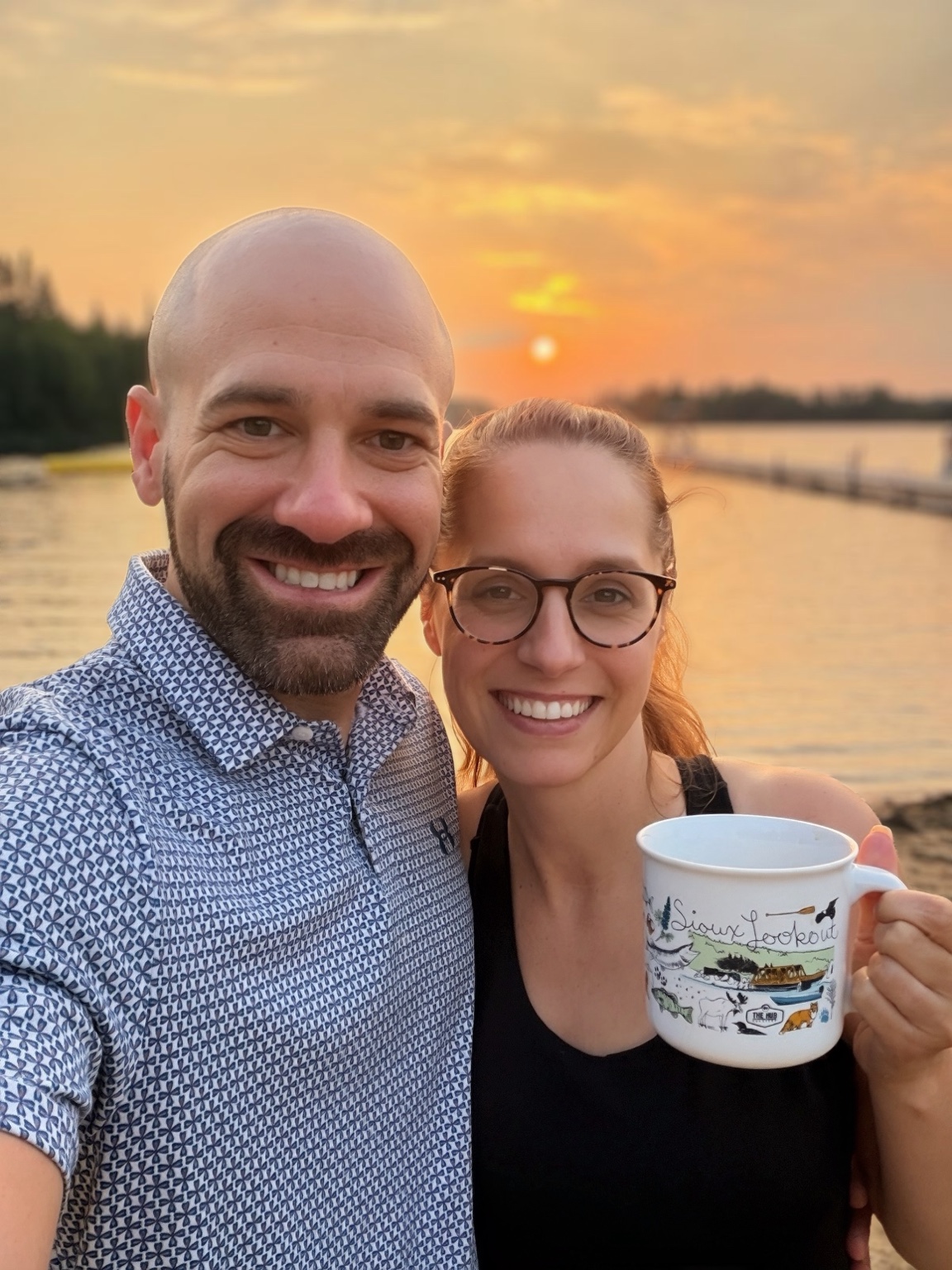 Ashley and Matt with The Sioux Lookout Mug at sunset