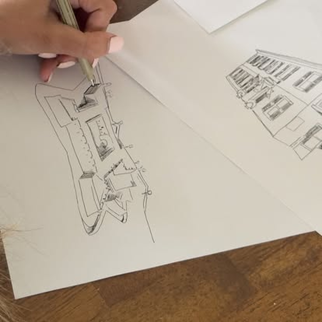 Ashley drawing architectural details for The St. Augustine Mug