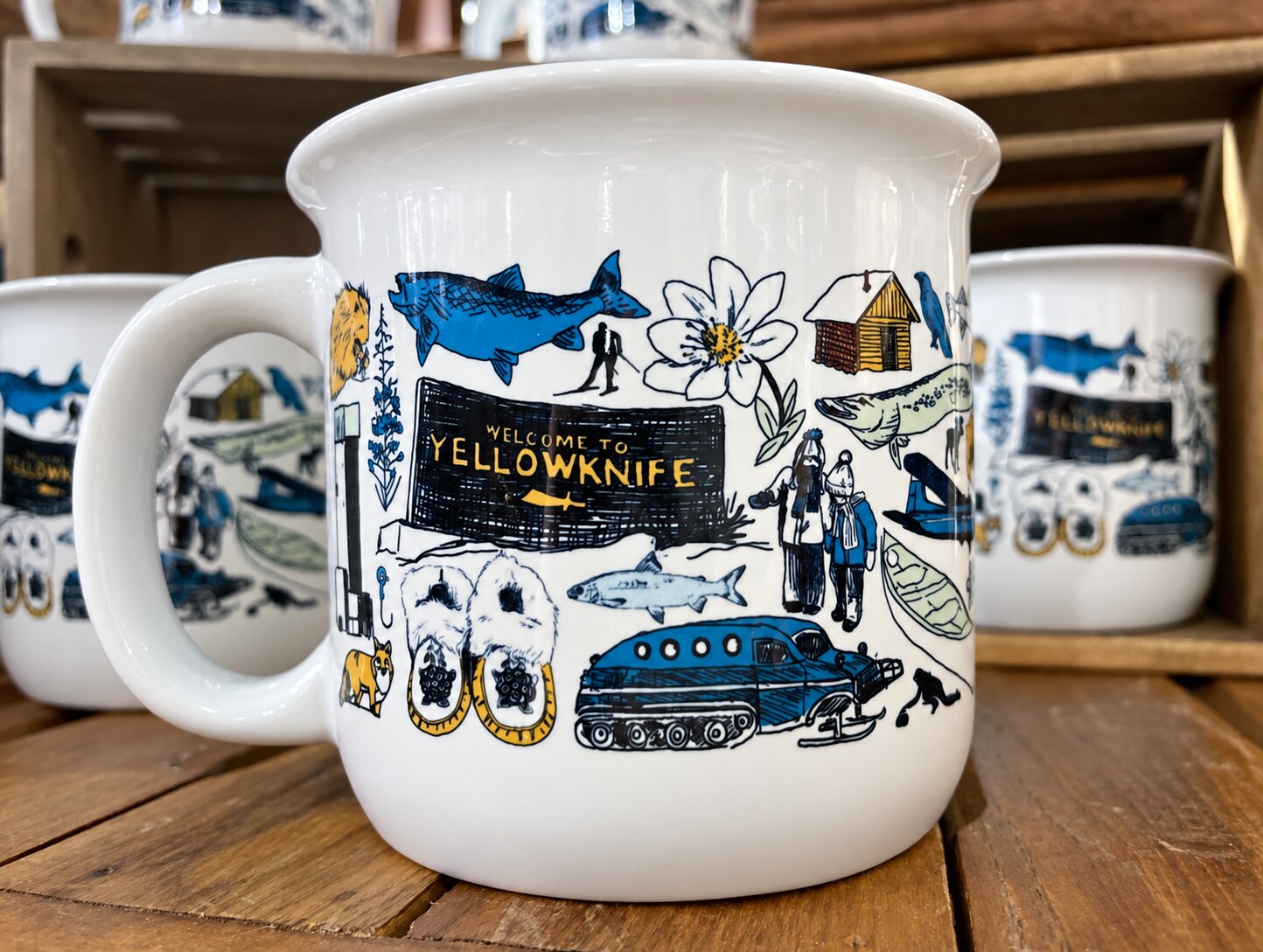 Close-up of the hand-drawn artwork on The Yellowknife Mug at The Cabin