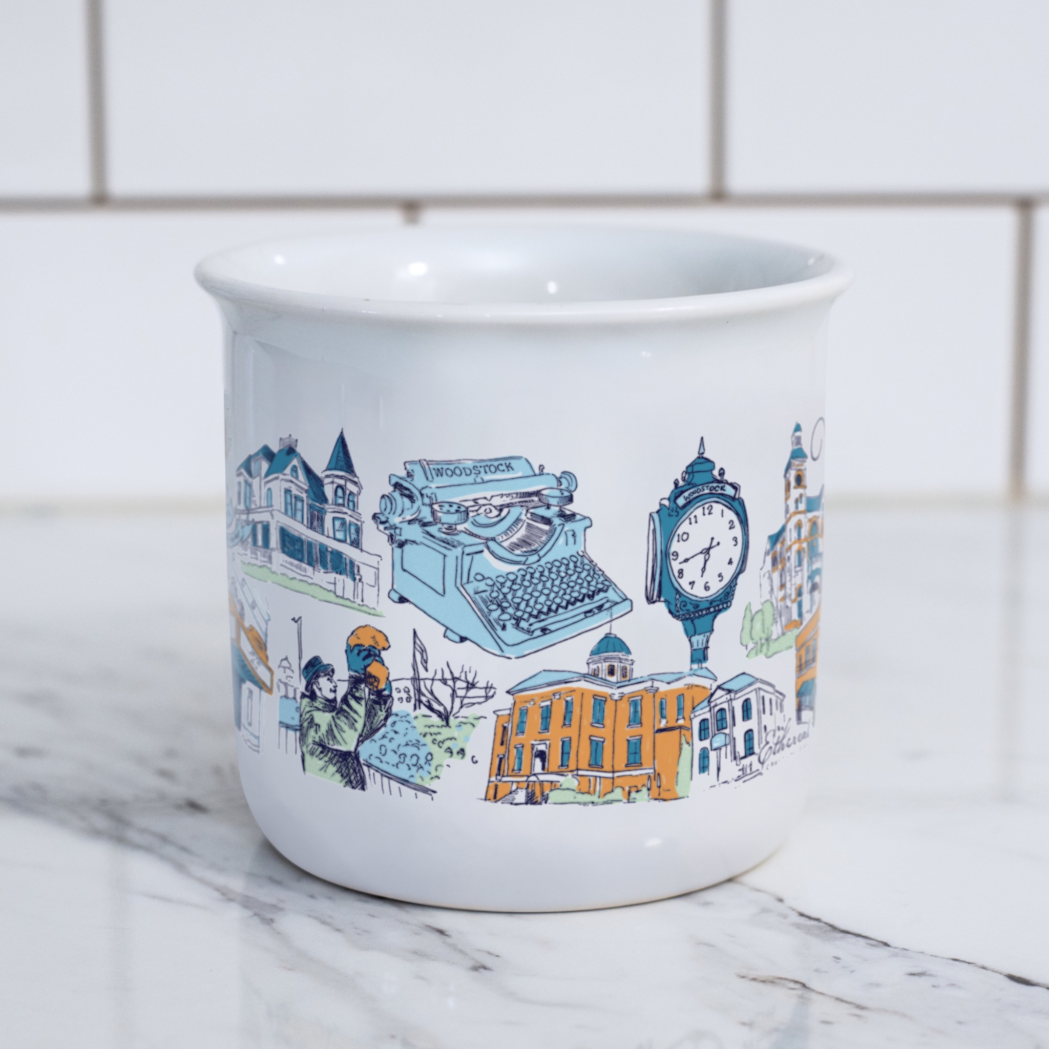 Side view of The Woodstock Mug showing hand-drawn Woodstock landmarks