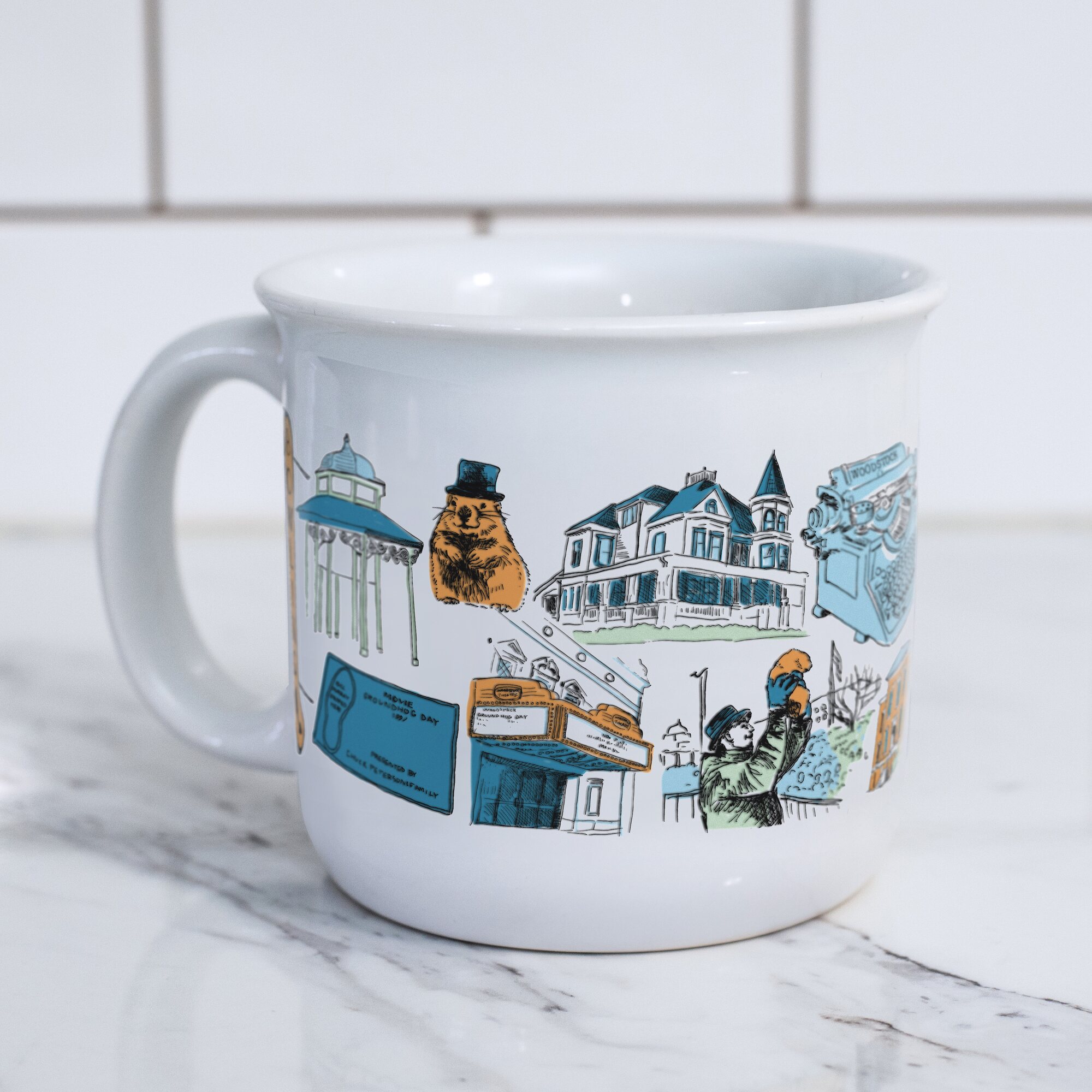 First mockup of The Woodstock Mug showing the gazebo, Woodstock Willie, Victorian home, movie theater, and Ethereal